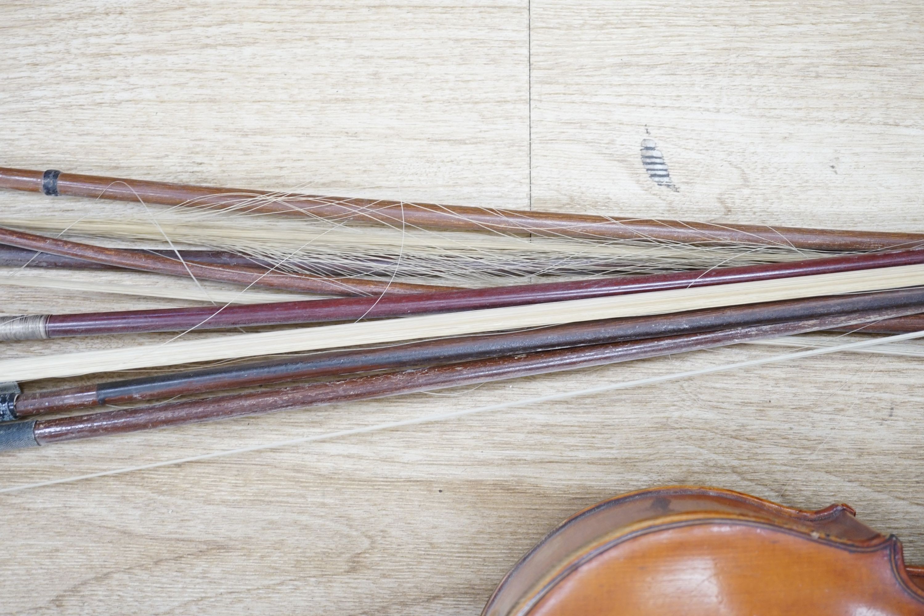 A Viola, assorted bows and a violin back